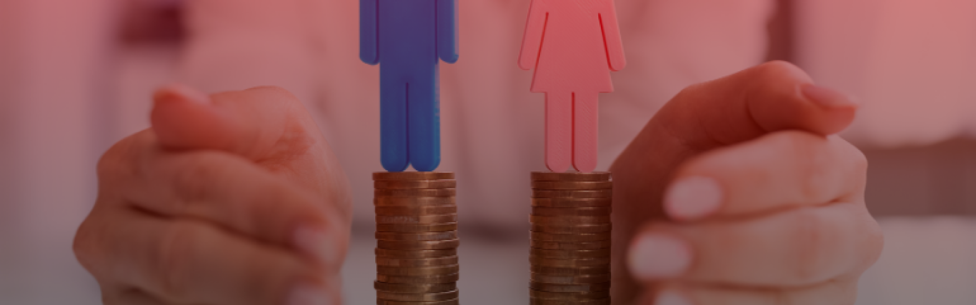 two stacks of coins with a blue man and a pink women atop