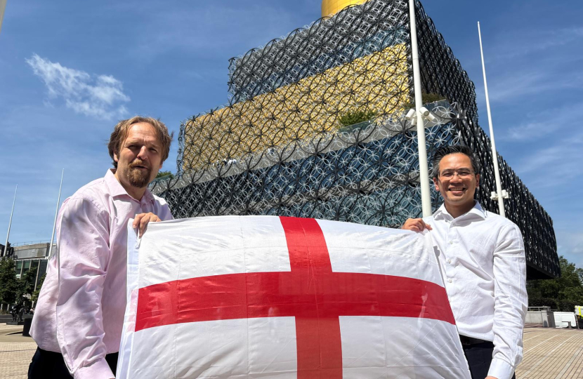 Cllrs Alden and Yip with a St George's cross flag