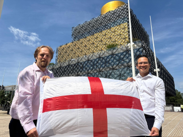 Cllrs Alden and Yip with a St George's cross flag